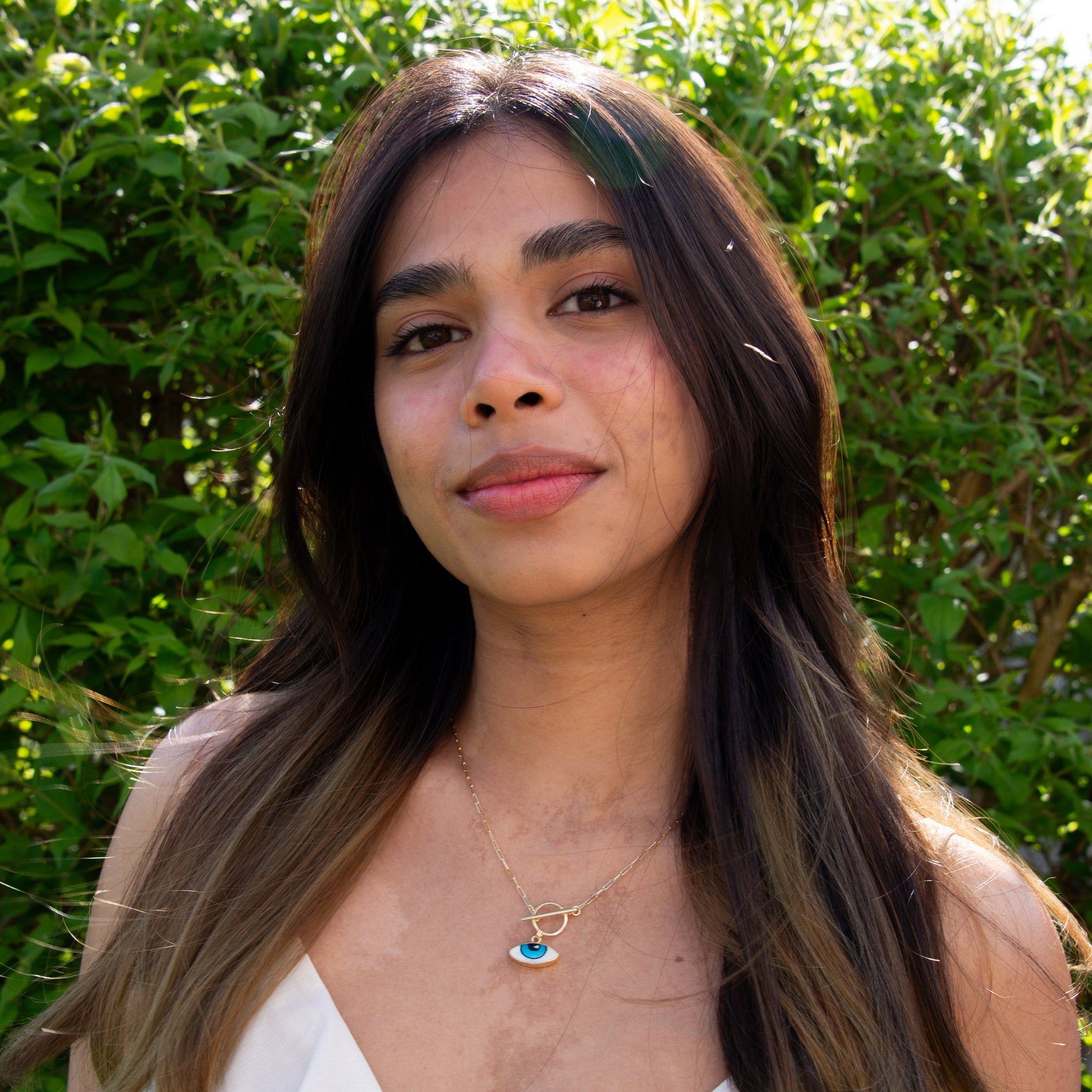 Woman wearing Adrano Eye Pendant and Paperclip Chain Necklace in 18K Gold Plated 925 Sterling Silver.