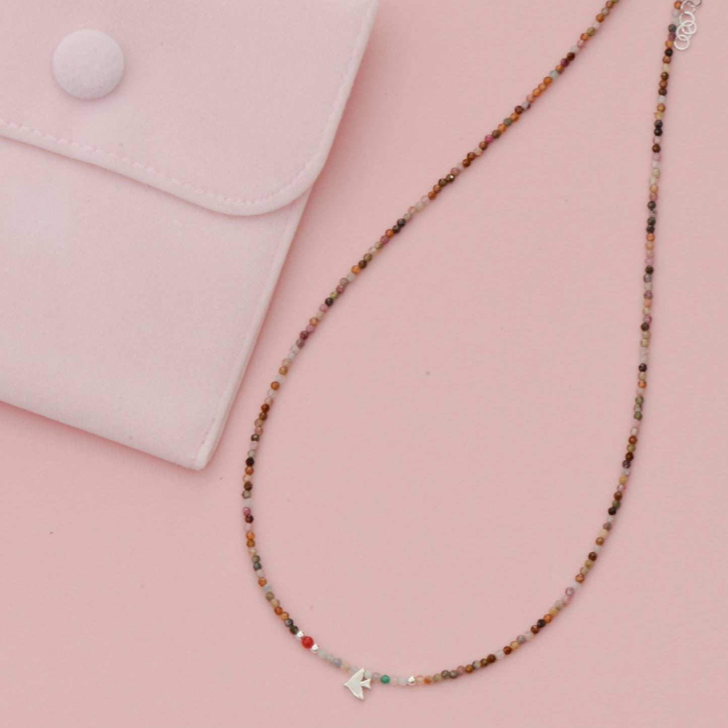 Amore Minimal Tourmaline Necklace - Handcrafted 925 Silver Displayed Next to Pink Pouch