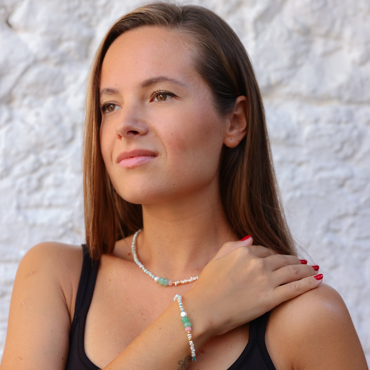 Woman wearing Andria Pearl & Turquoise Gemstone Necklace.