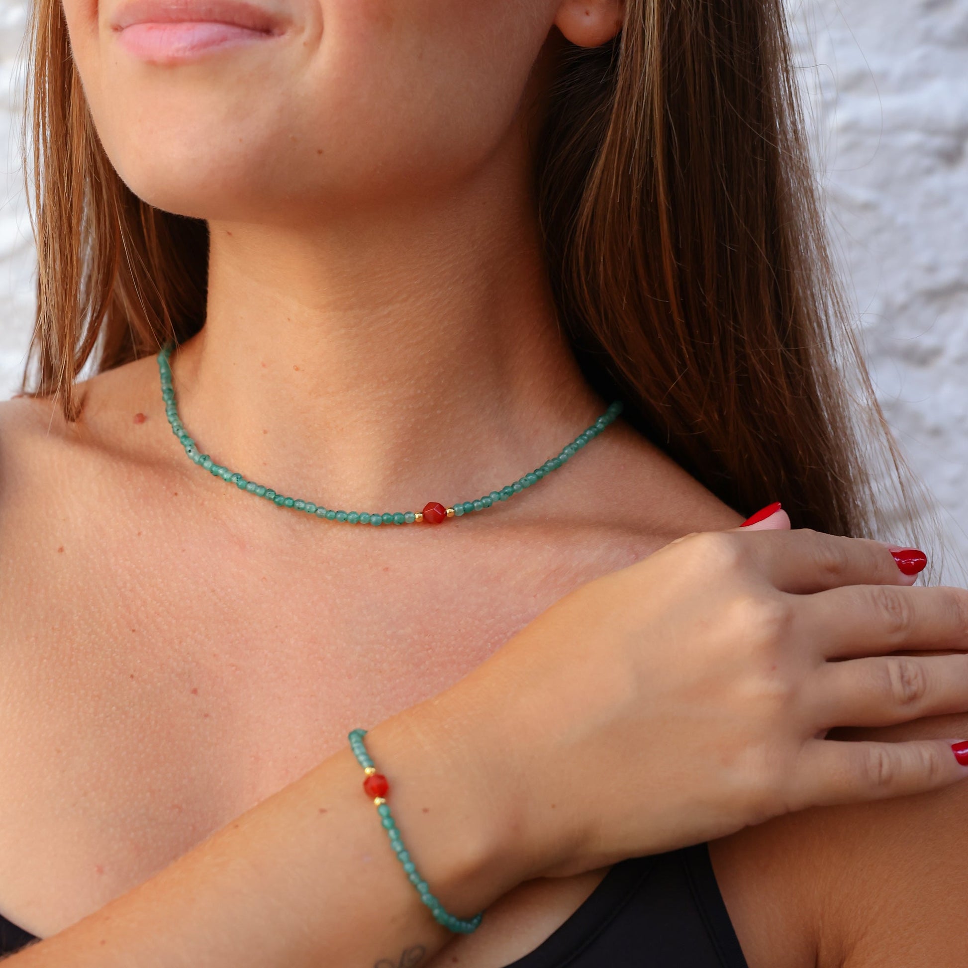 Woman wearing Aventurin & Carnelian Gemstone Necklace with matching bracelet