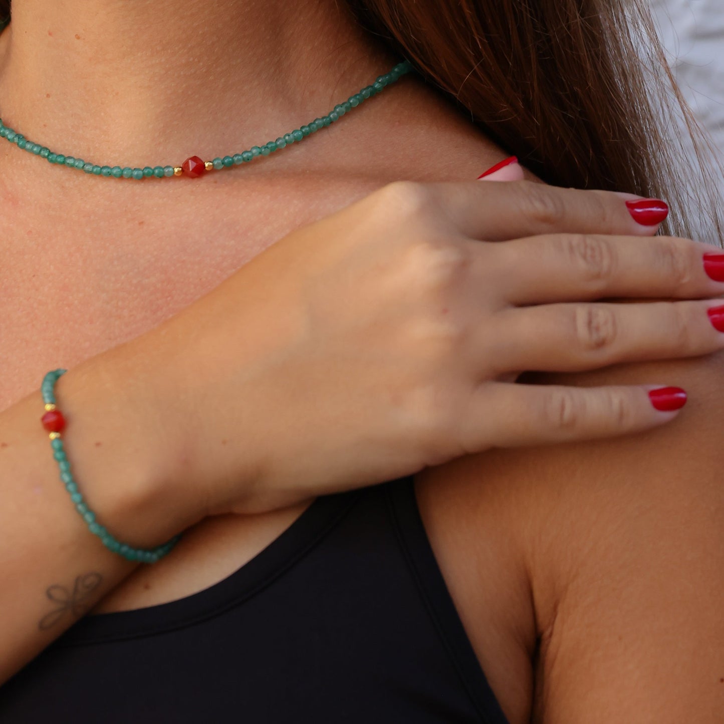 Woman wearing Aventurin & Carnelian Gemstone Necklace and matching bracelet