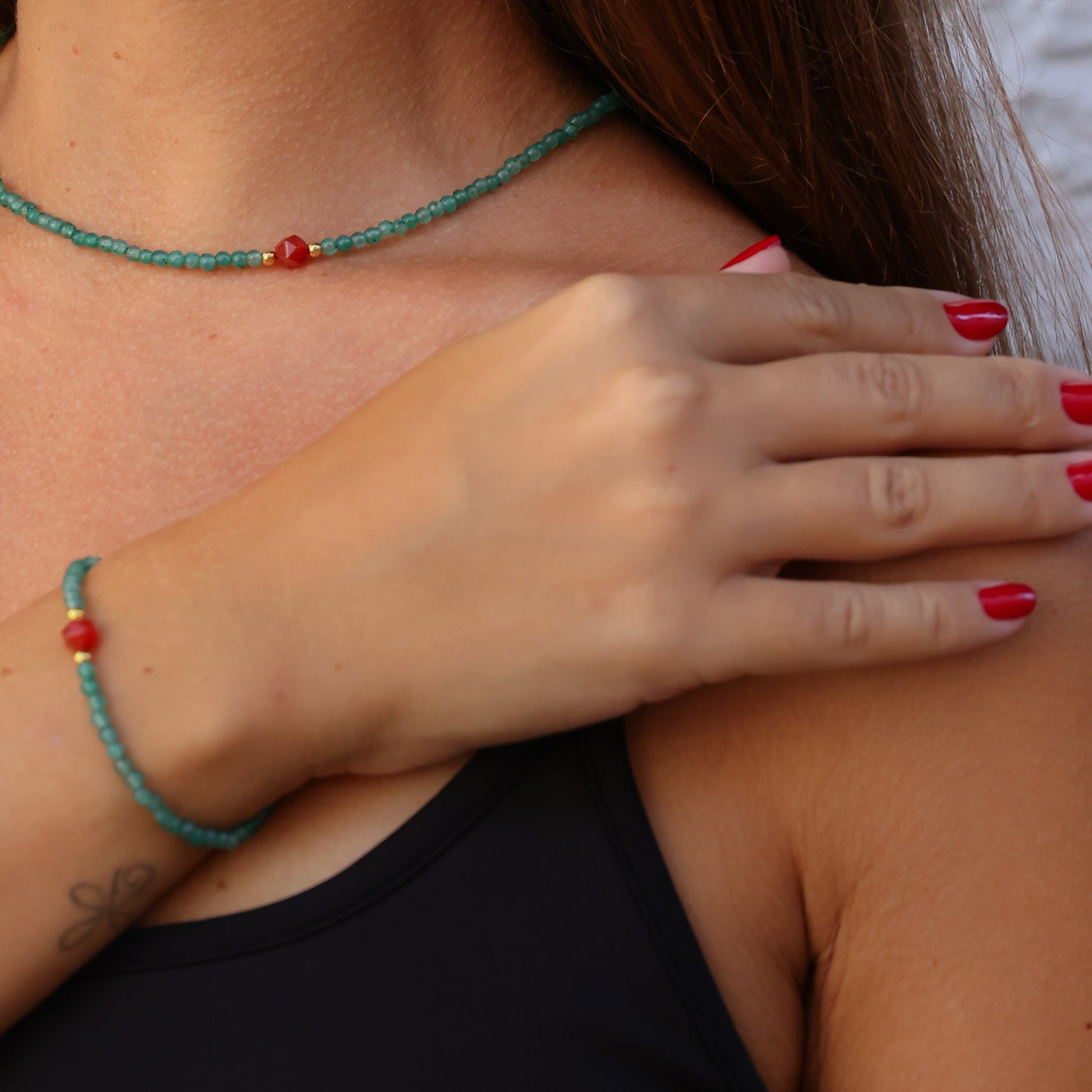 Woman wearing Aventurin & Carnelian Gemstone Necklace and matching bracelet