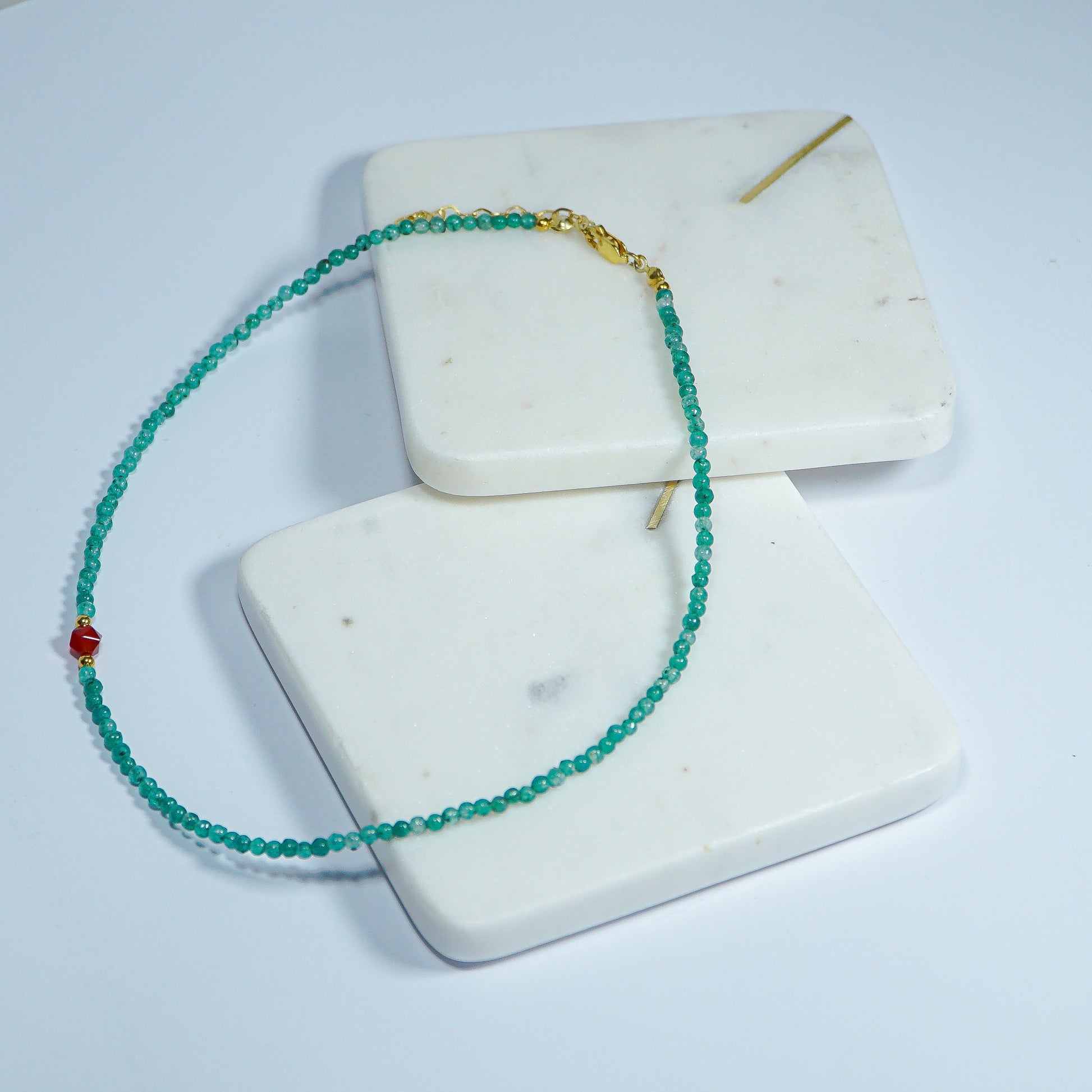 Aventurin & Carnelian Gemstone Necklace on white marble tiles