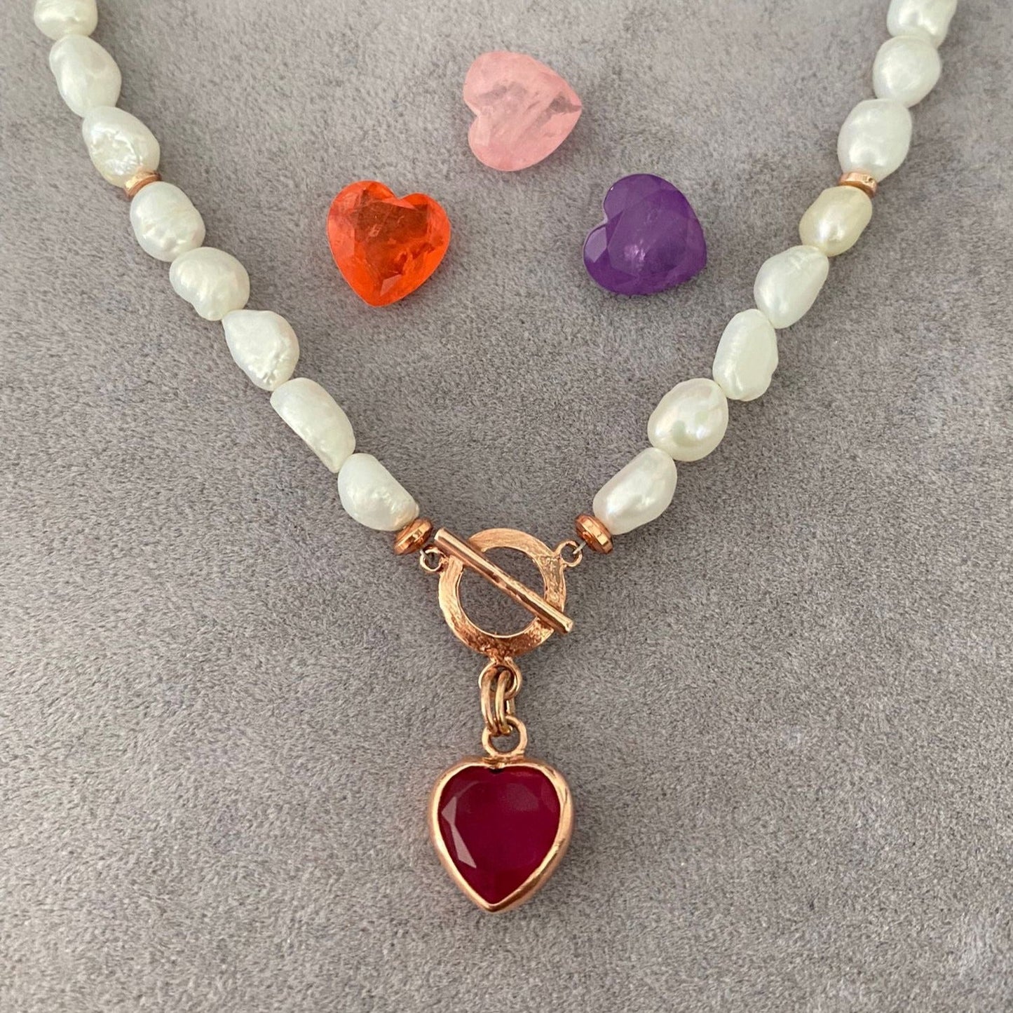 Baroque Pearl Heart Necklace with Gemstone Charms on Grey Background