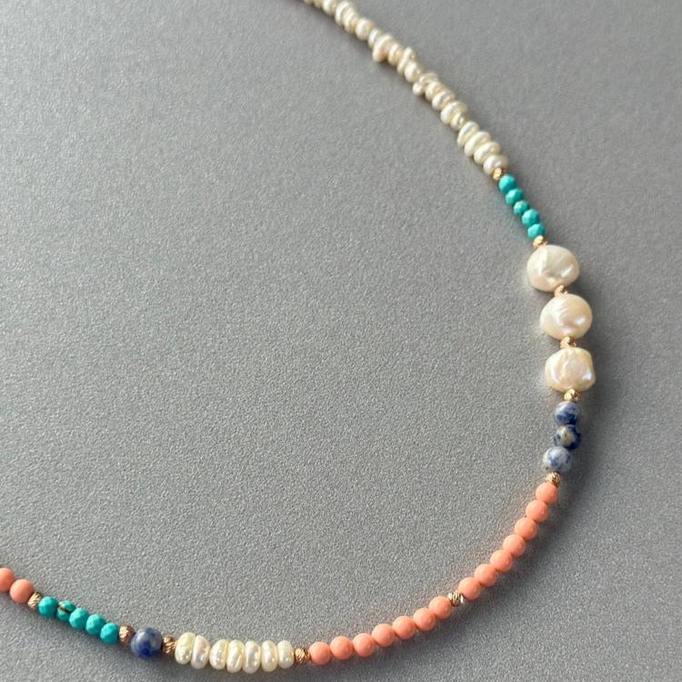 Comiso Pearl and Gemstones Necklace featuring a mix of pearls, turquoise, and coral beads