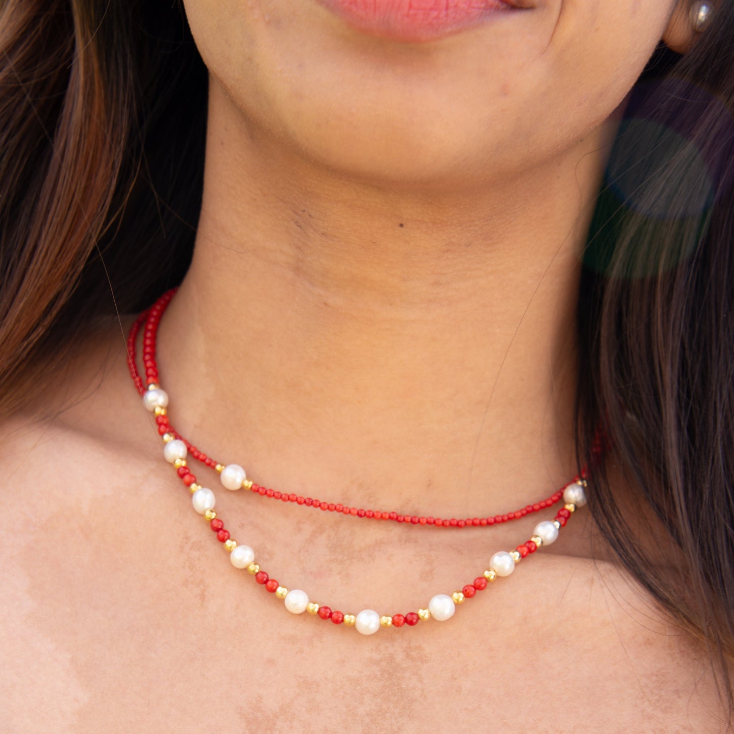 Cueno Coral Gemstone Freshwater Pearl Necklace on woman's neck