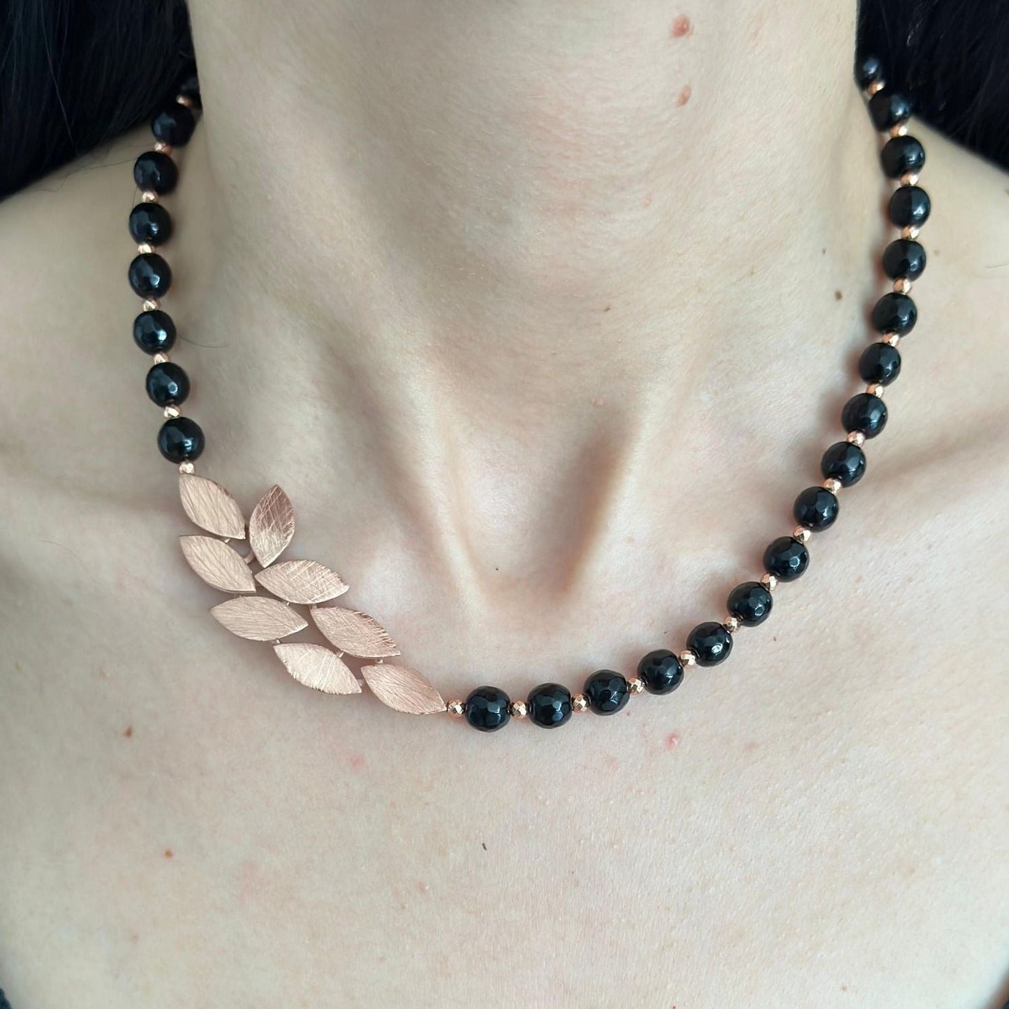 Elegant Leaves Onyx Necklace - 925 Silver Rose Gold Plated on a model's neck