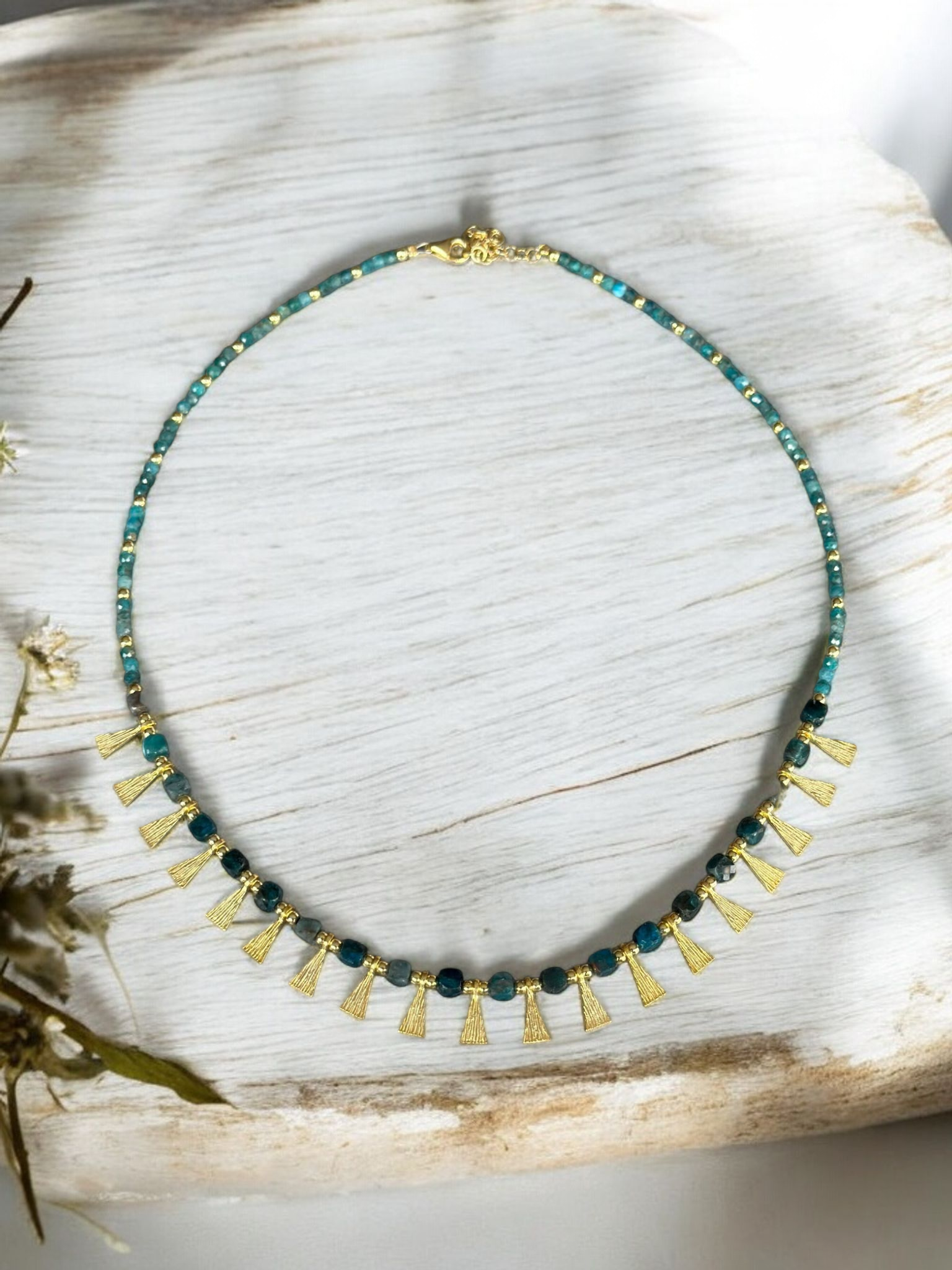 Eva Necklace with Apatite Gemstone in 925 Sterling Silver Gold Plated displayed on white wooden background