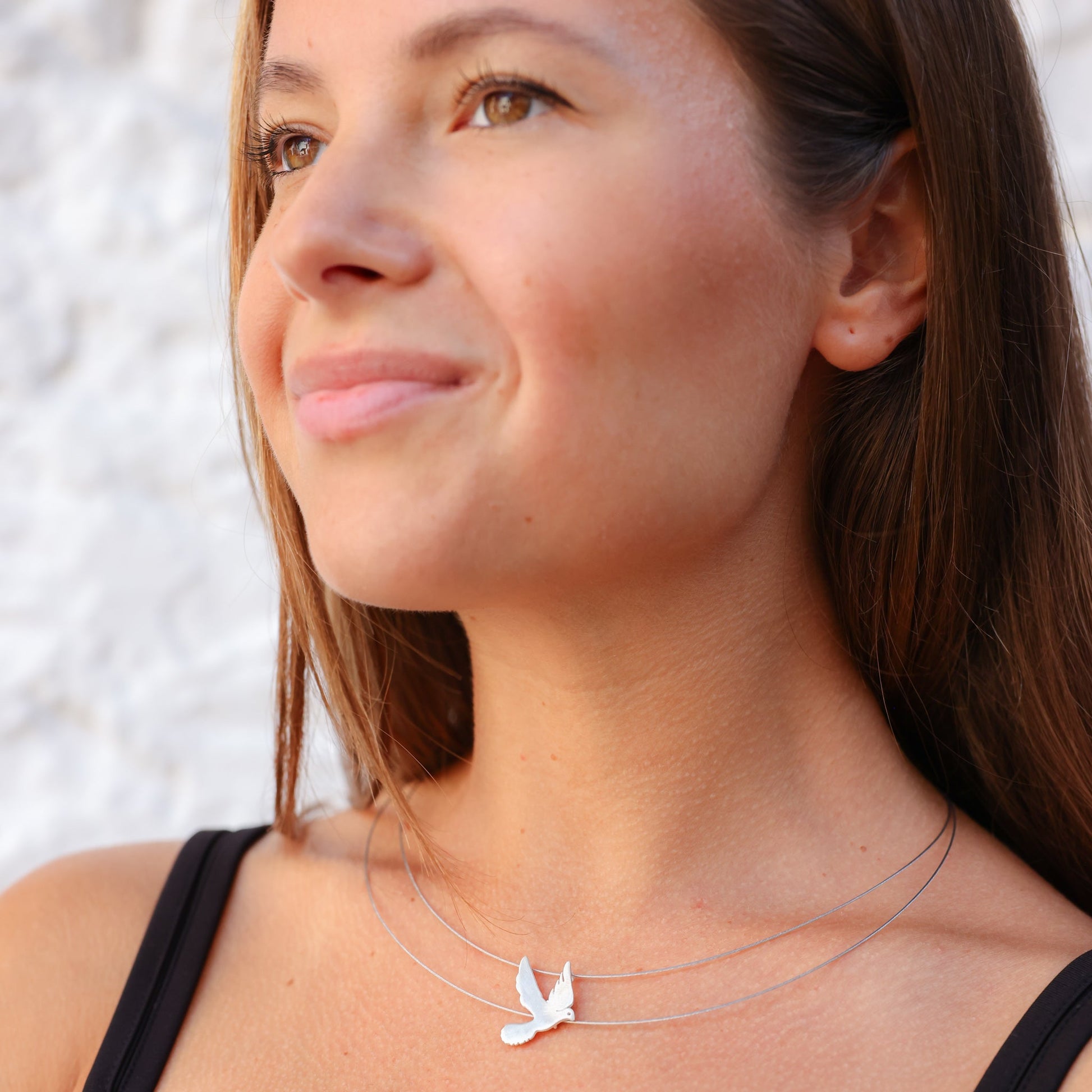 Woman wearing Free Bird on a Wire Silver Necklace