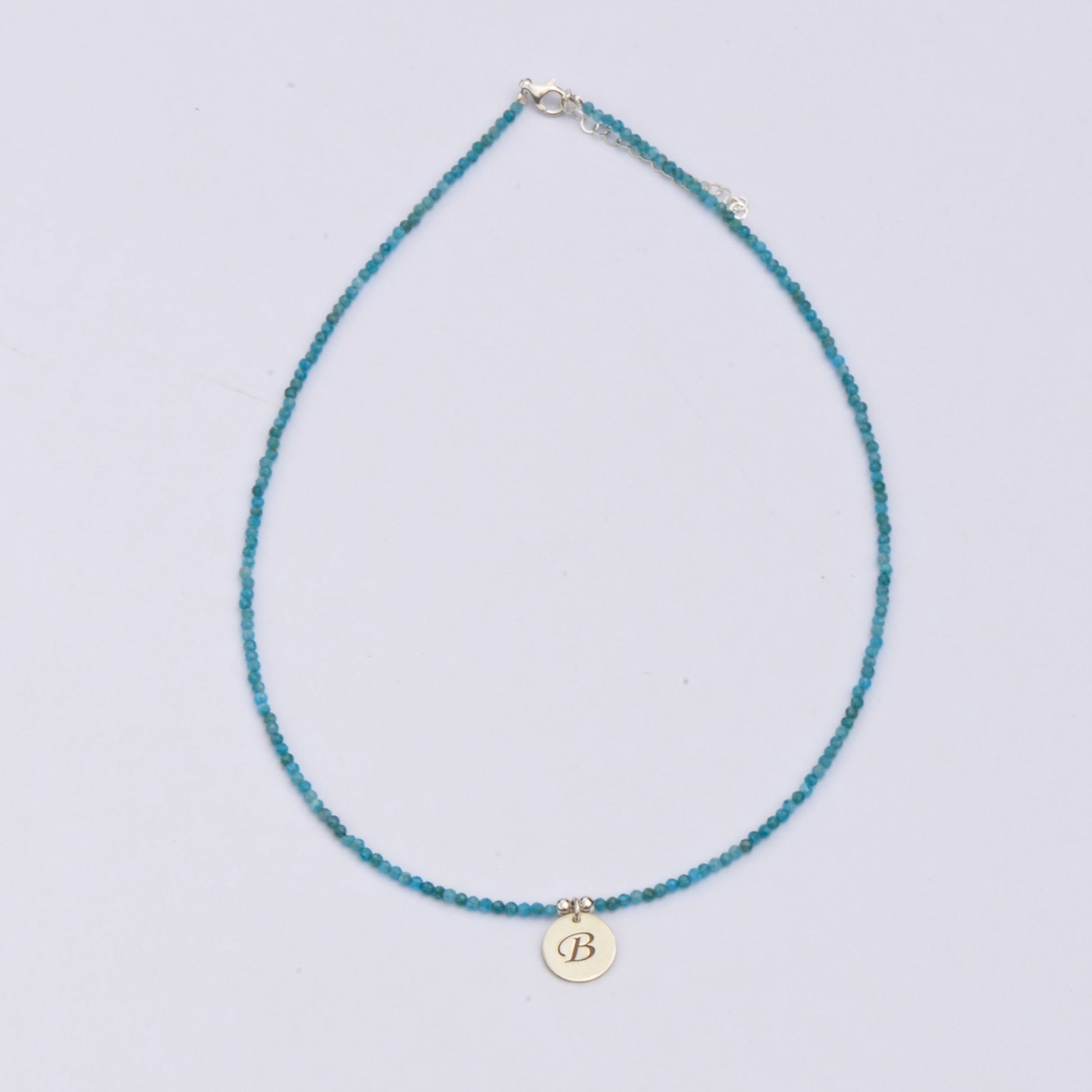 Gemstone Beaded Initial Necklace with blue beads and a gold pendant featuring the letter B.