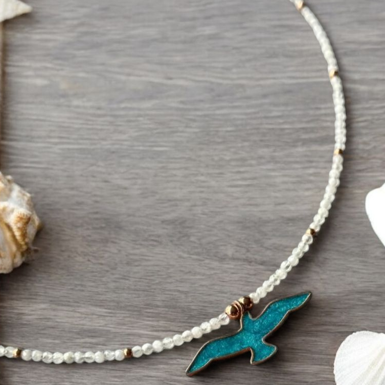 Istanbul Moonstone Seagull Necklace with a blue seagull pendant on a pearl beaded chain