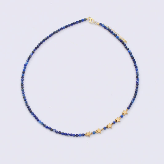 Lapis Lazuli Gemstone Beaded Stars Necklace with golden star accents on a white background