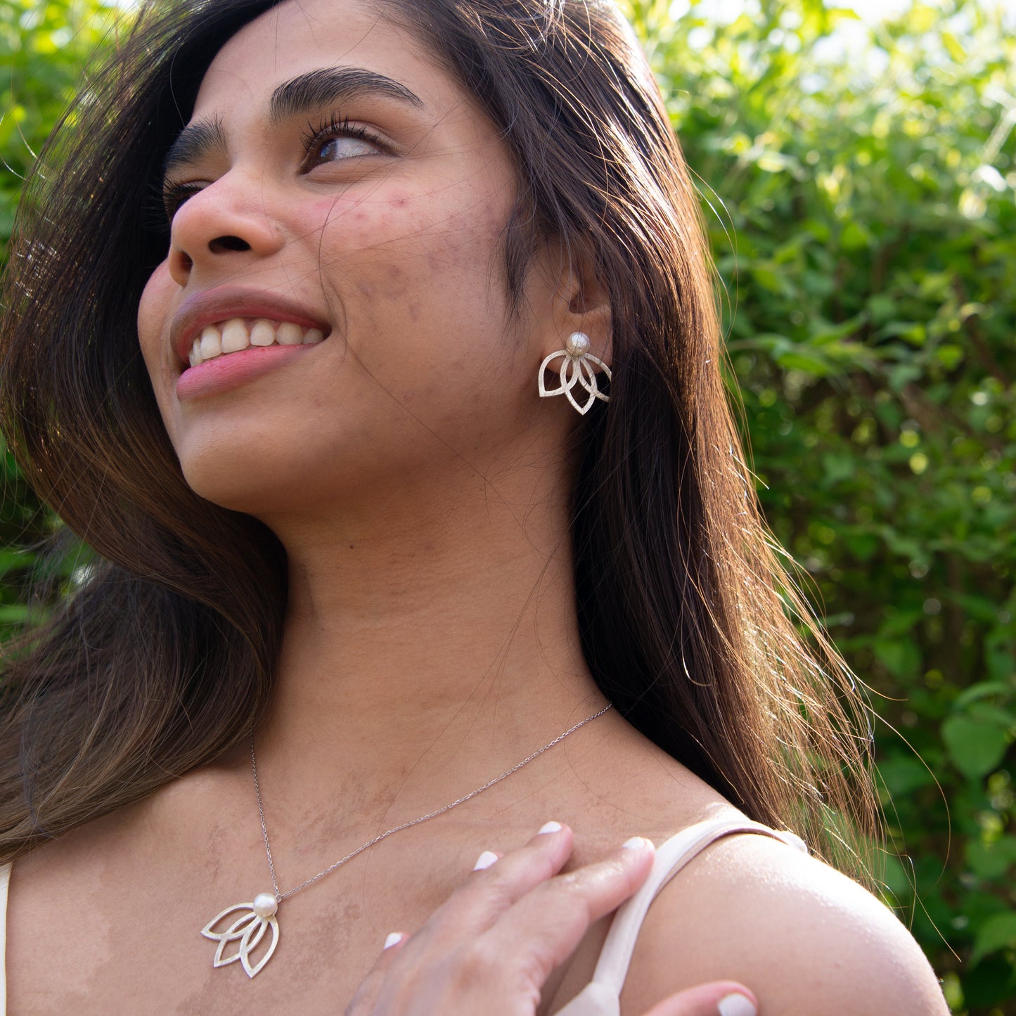 Woman wearing Lotus Flower Silver and Freshwater Pearl Necklace and Earrings Set