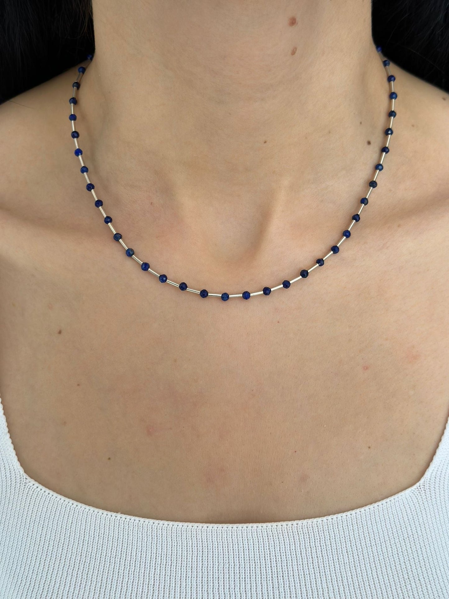 Melia Lapis Lazuli Gemstone and Silver Necklace on a woman's neck