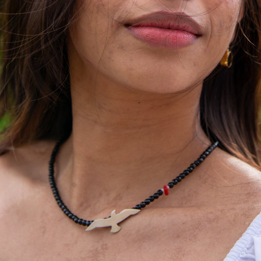 Woman wearing Onyx Seagull and Red Bead Silver Necklace