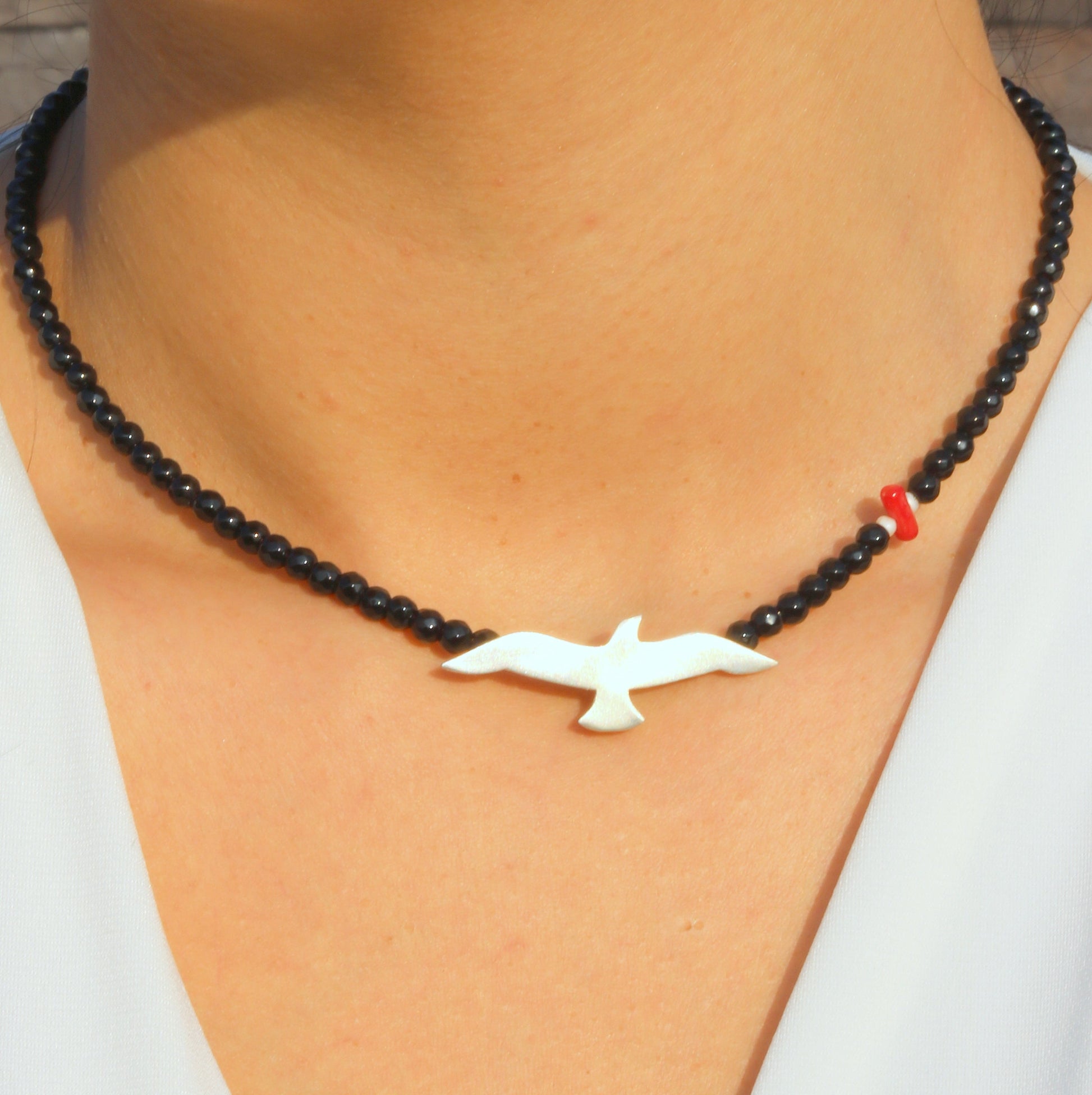 Onyx Seagull and Red Bead Silver Necklace display