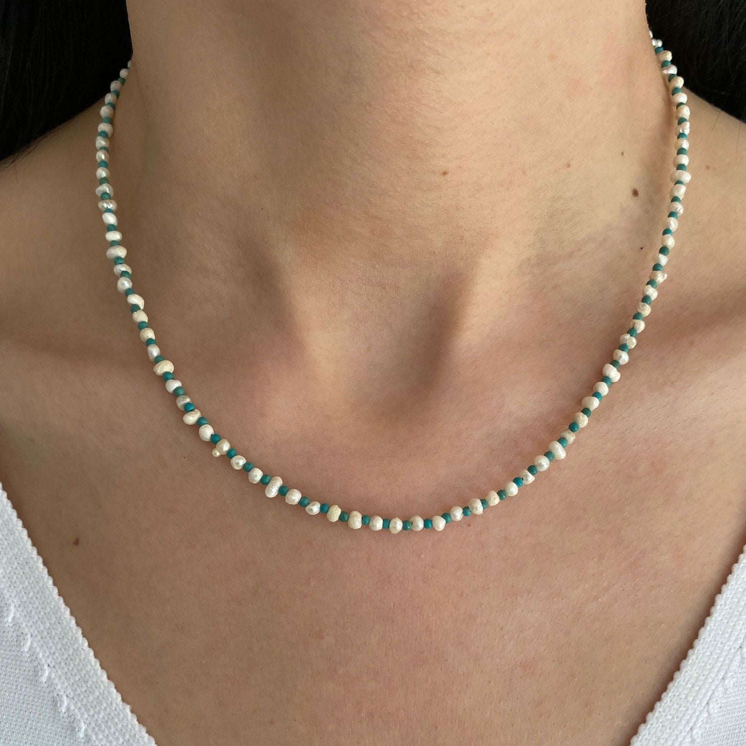 Pearl and Blue Howlite Gemstone Beaded Necklace on woman's neck