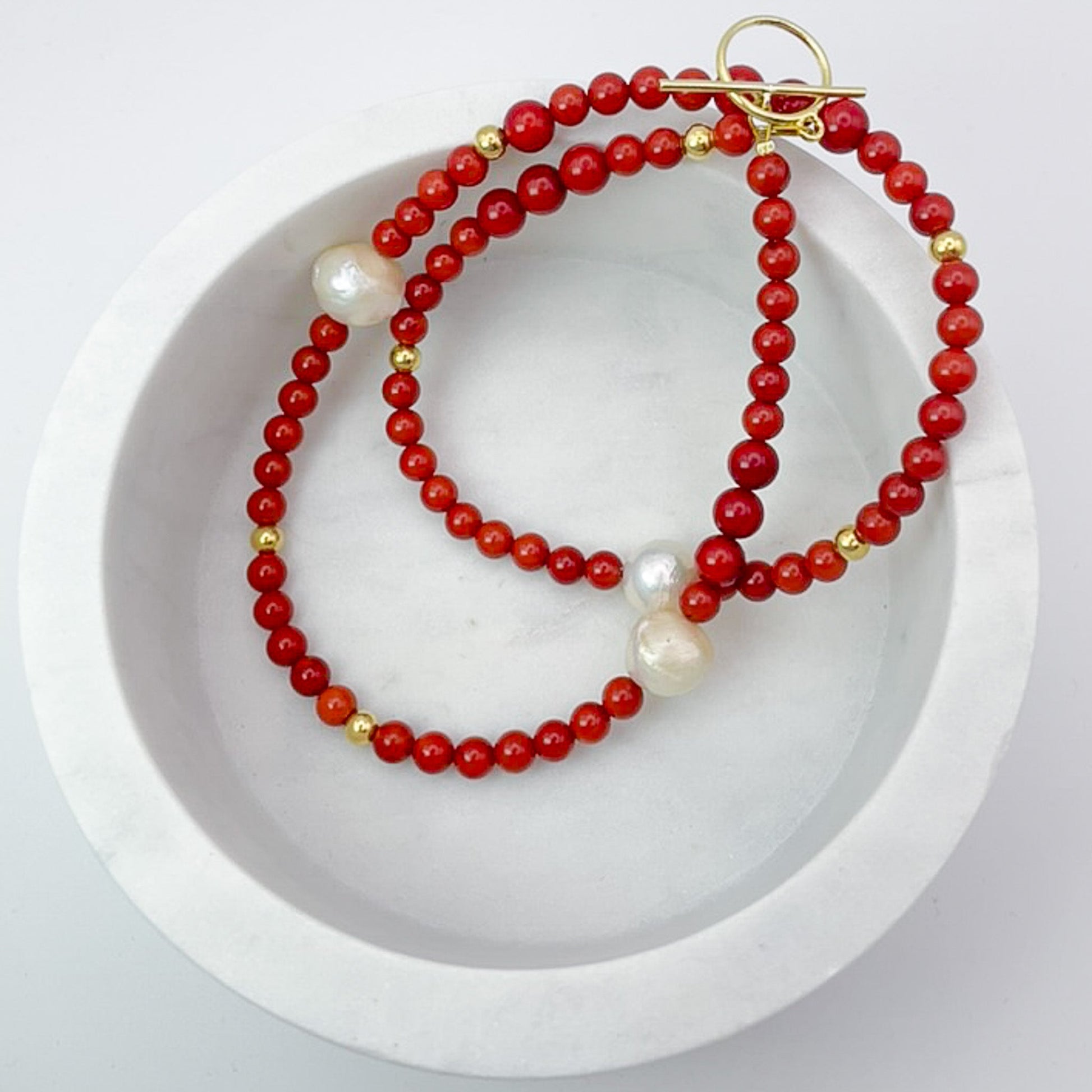 Red Coral Gemstone Necklace with Baroque Freshwater Pearls in a white bowl