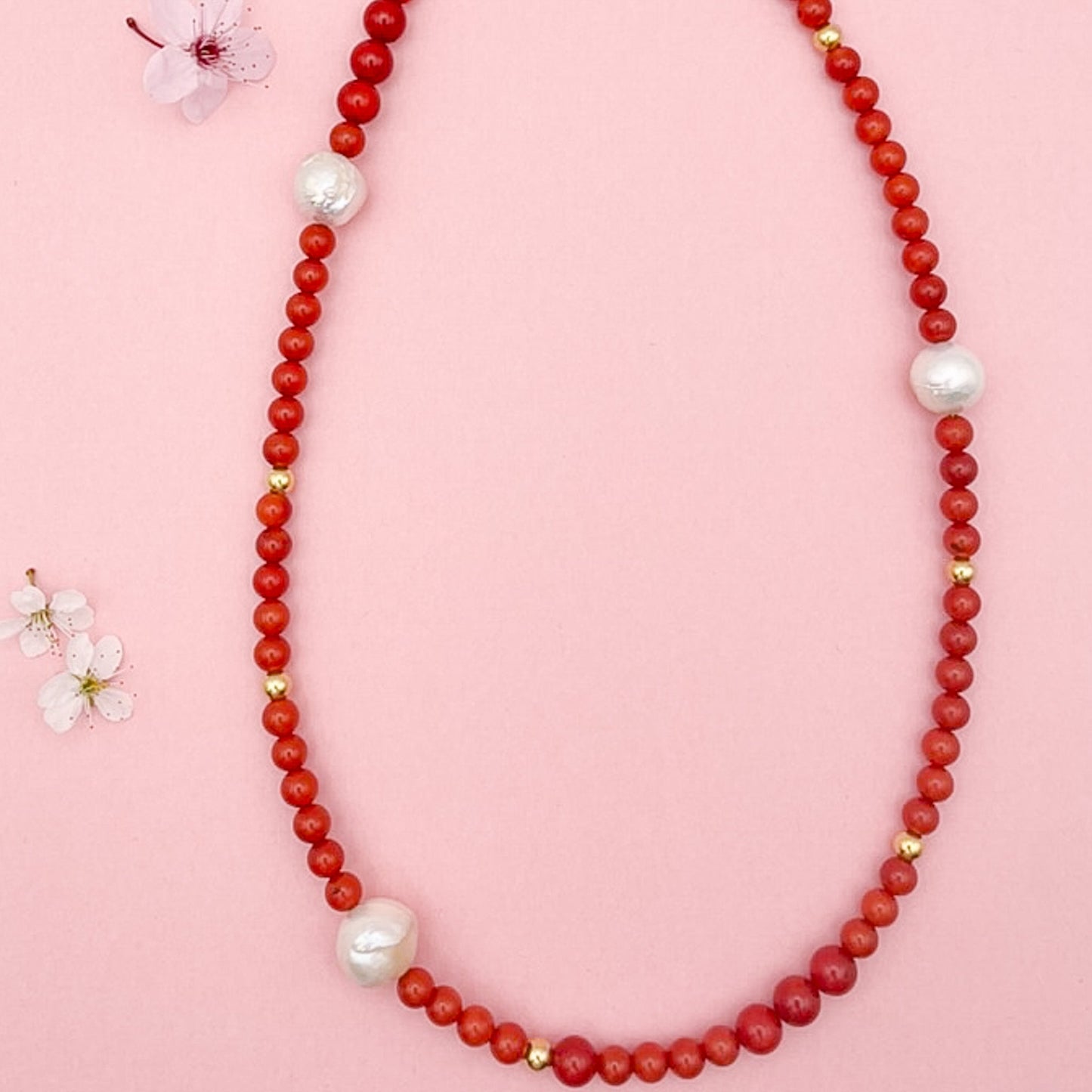 Red Coral Gemstone Necklace with Baroque Freshwater Pearls on Pink Background