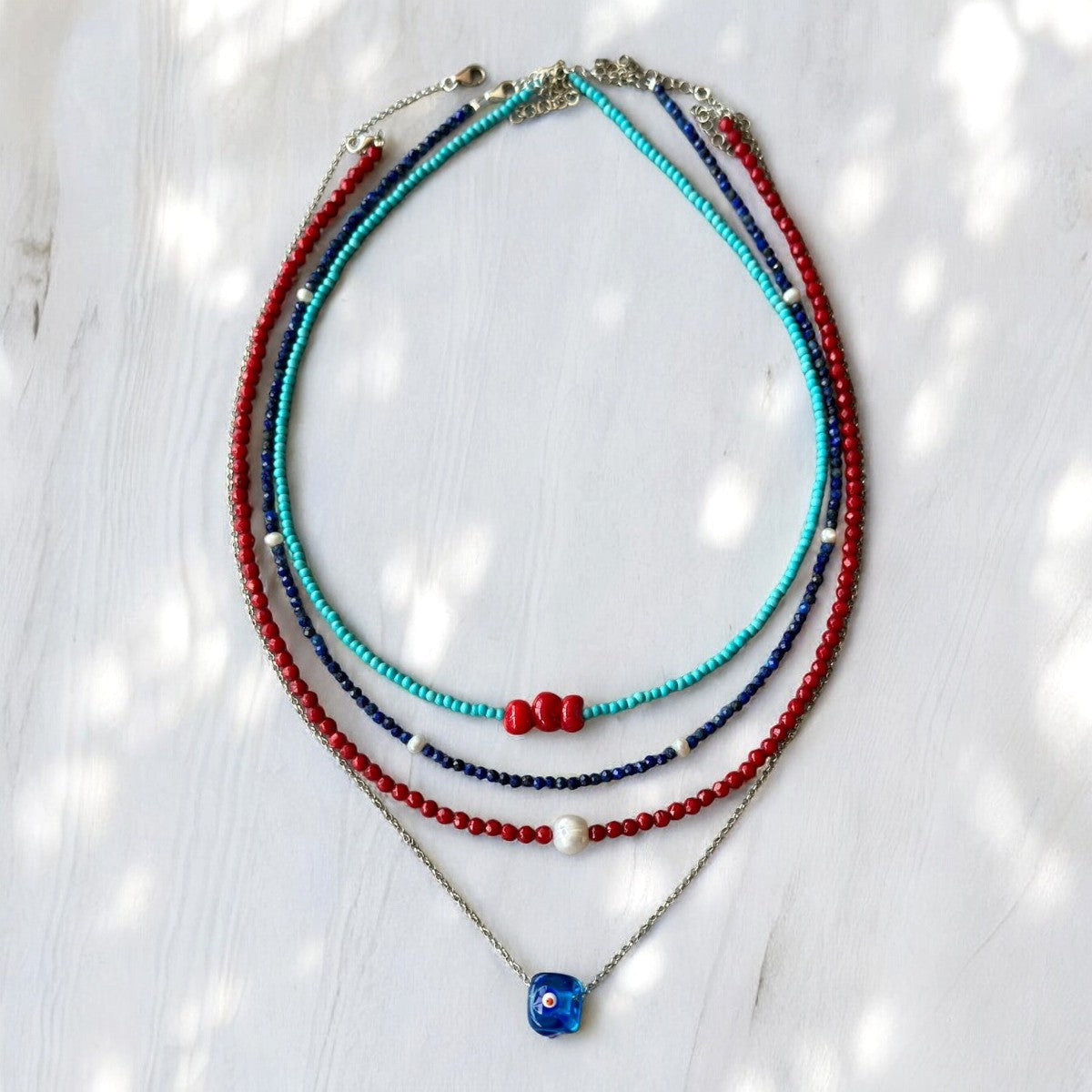 Reds and Blues Gemstone and Silver Necklace Set featuring multiple delicate strands