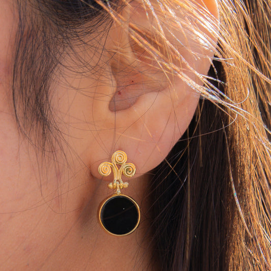 Rho Natural Onyx Gemstone Drop Earrings on ear showcasing intricate design and craftsmanship.