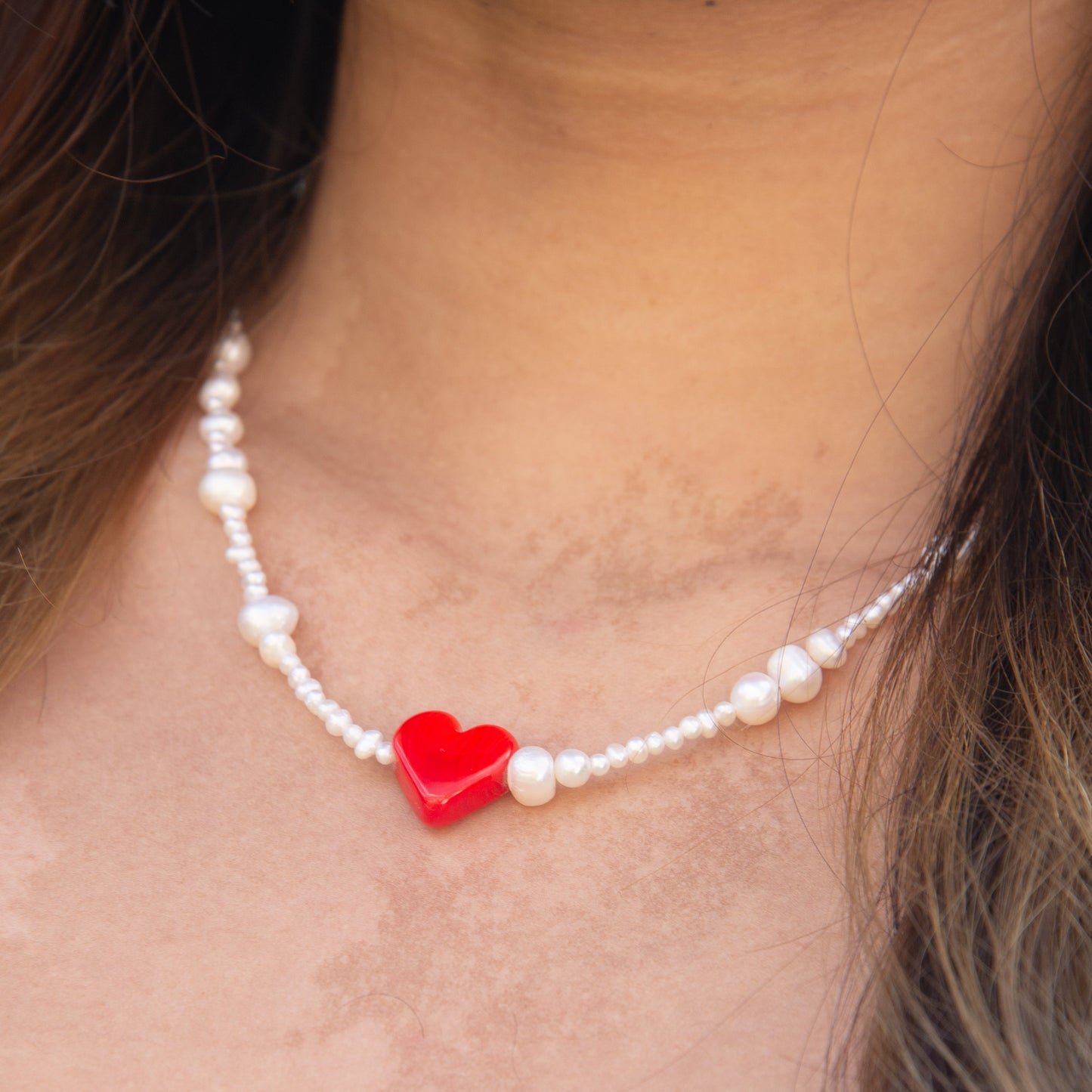 Close-up of Rojo Natural Freshwater Pearl Necklace with Red Glass Heart Pendant