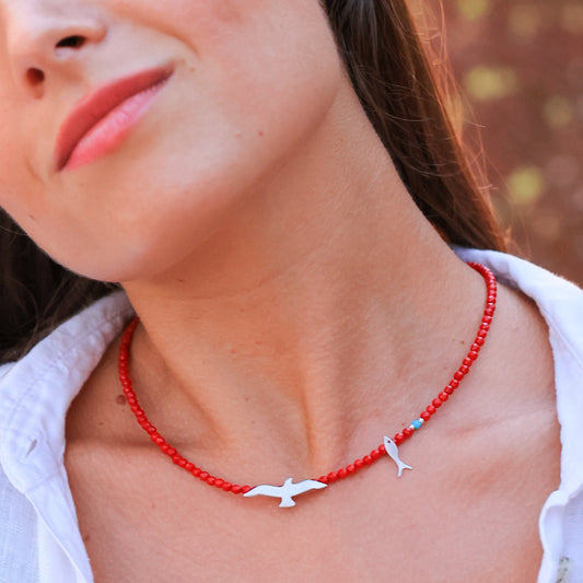 Woman wearing a Seagull & Fish Coral and Silver Necklace