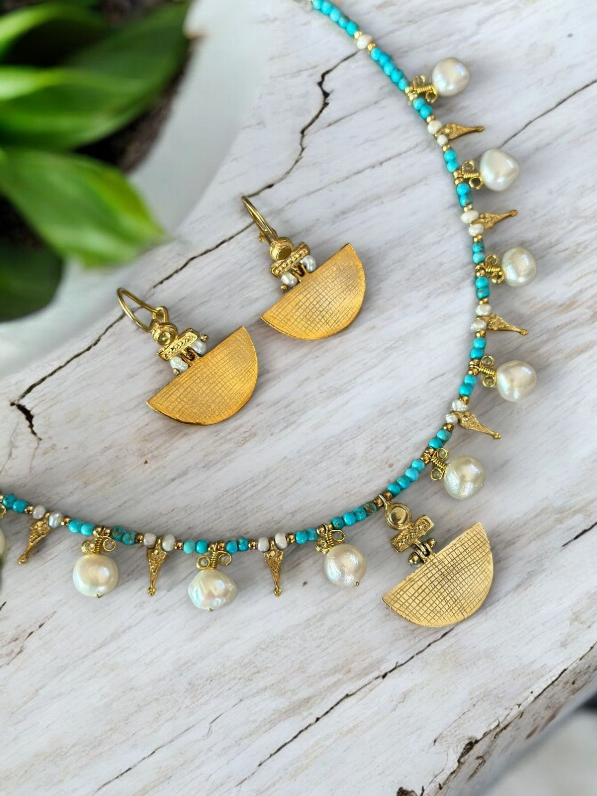 Selena Turquoise Necklace and Earrings Set - 14K Gold Plated with Faux Pearls on a Wooden Surface