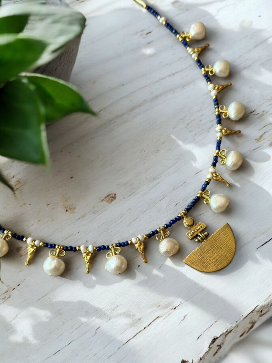 Selene Lapis Lazuli Gemstone and Pearl Necklace with Gold Plating displayed on a white surface.