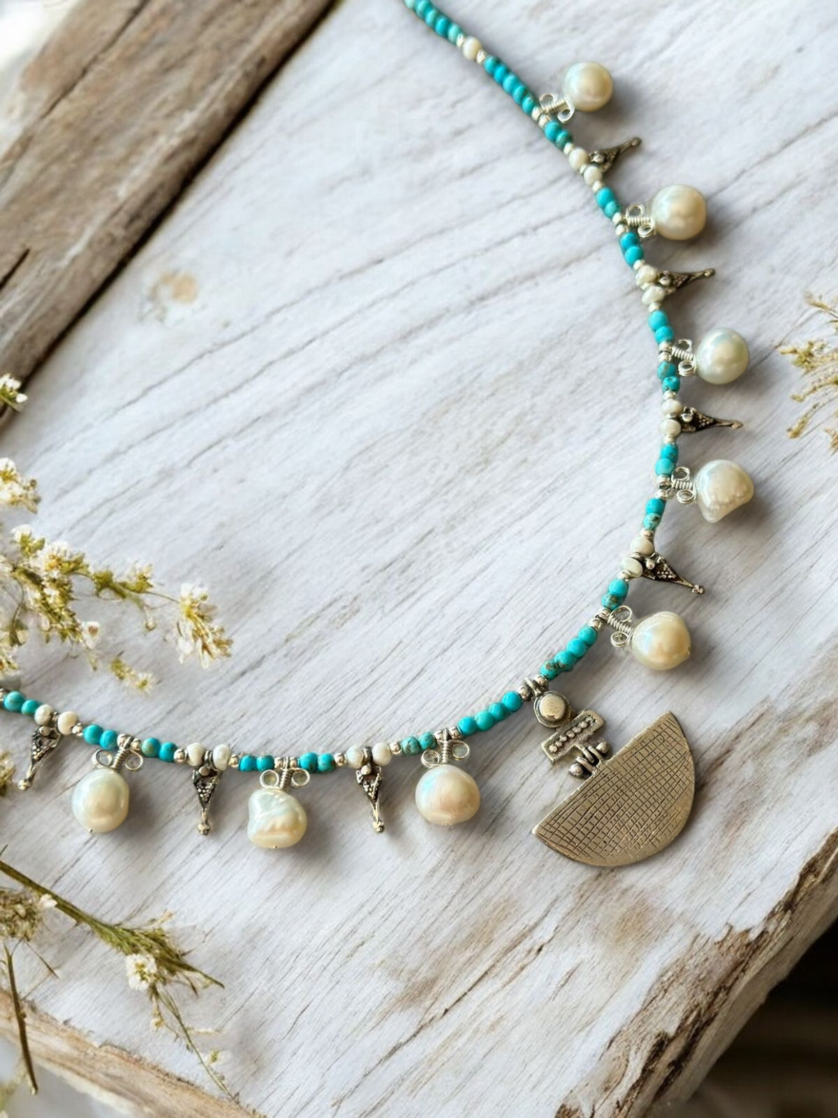 Selene Turquoise Gemstone and Pearl Necklace on wooden background