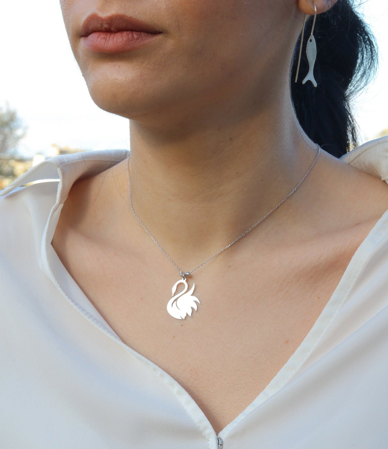 Woman wearing Swan 925 Sterling Silver Necklace featuring a swan pendant on a delicate chain