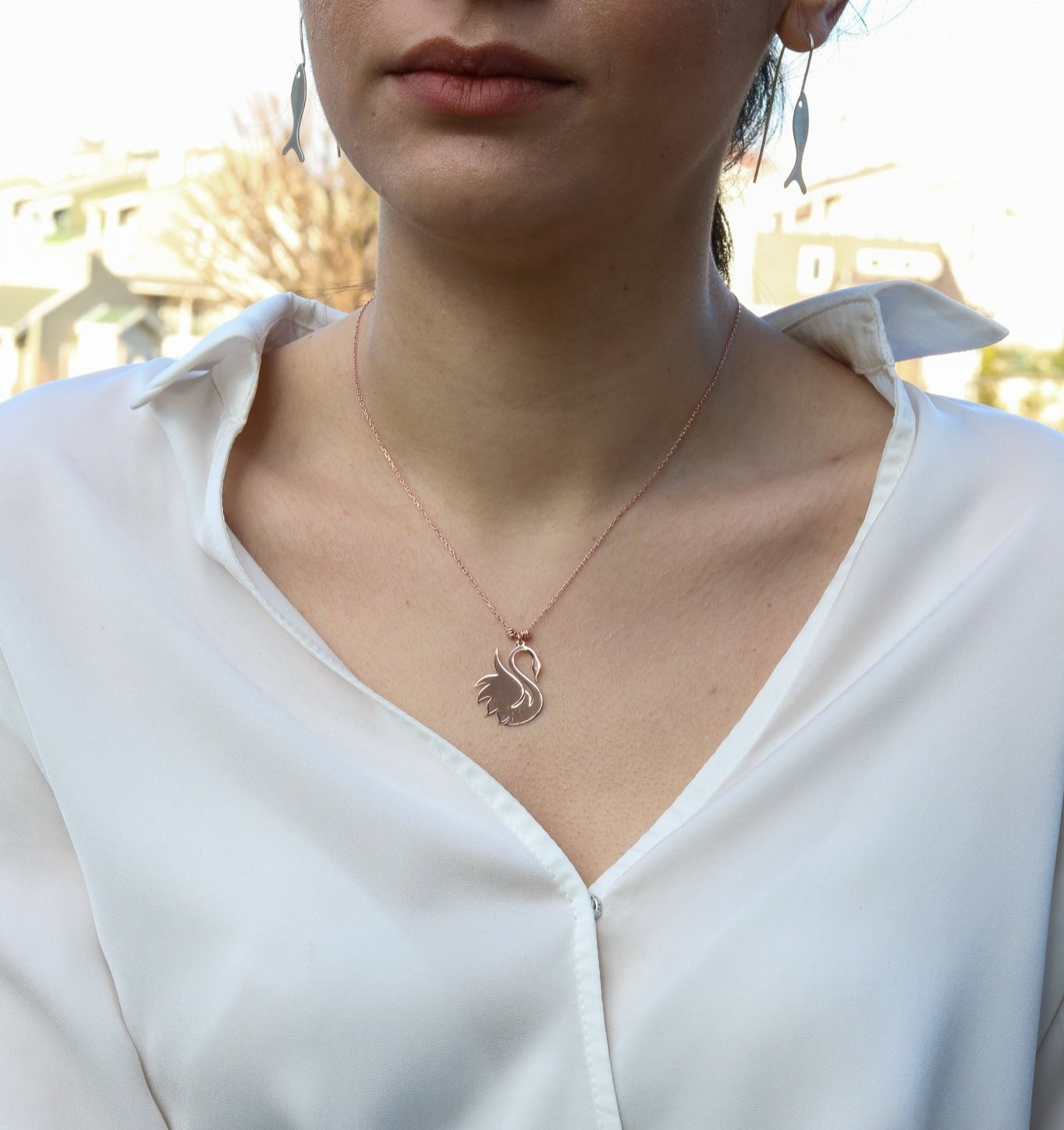 Swan 925 Sterling Silver Rose Gold Necklace worn by a woman in a white blouse.