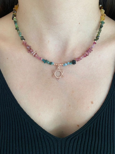 Tourmaline Flower Silver Necklace worn by a model, showcasing the vibrant multi-colored gemstones and an elegant floral pendant